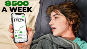 Person lying in bed holding a smartphone showing $48,274 total balance with text '$500 a week' – Passive income and online earnings concept