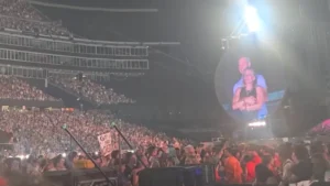 Astronomer CEO Andy Byron resigns after viral Coldplay concert incident; headline text with a professional portrait of Byron on the right.