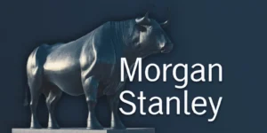 A large silver bull statue stands prominently next to the Morgan Stanley logo on a dark blue background, symbolizing bullish market sentiment and financial strength.