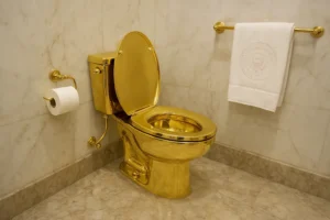 A realistic photograph showcasing an opulent gold-plated toilet in an ornate bathroom, symbolizing luxury and excess, linked to the viral post about the White House makeover under Donald Trump.