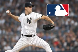 A professional photograph of a Major League Baseball pitcher mid-throw on the mound during a game, representing the ranking of top 10 starting pitchers in MLB.